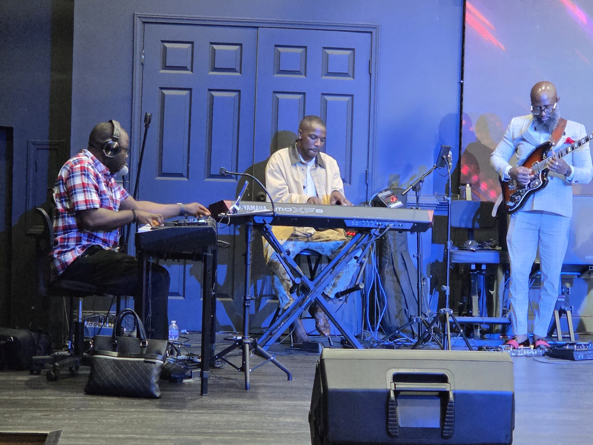 This picture features the two pianists and the guitarist giving a wonderful presentation.